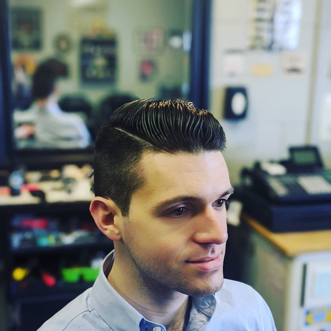 Client with a slicked-back pompadour haircut at Gary's Barber Shop