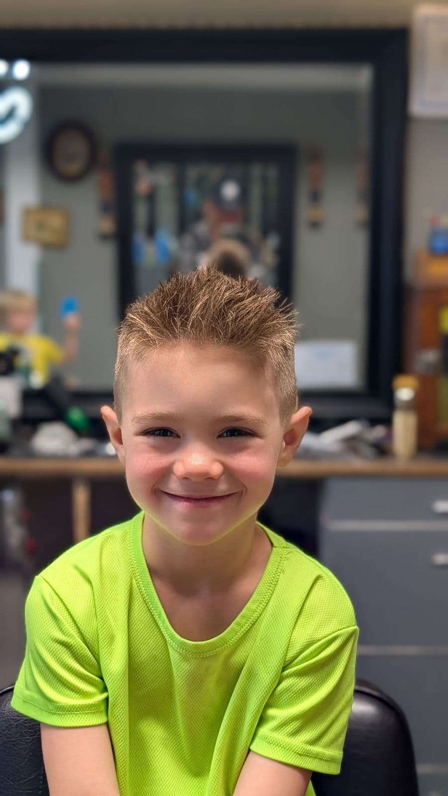 Young client with a short spiky fade haircut at Gary's Barber Shop