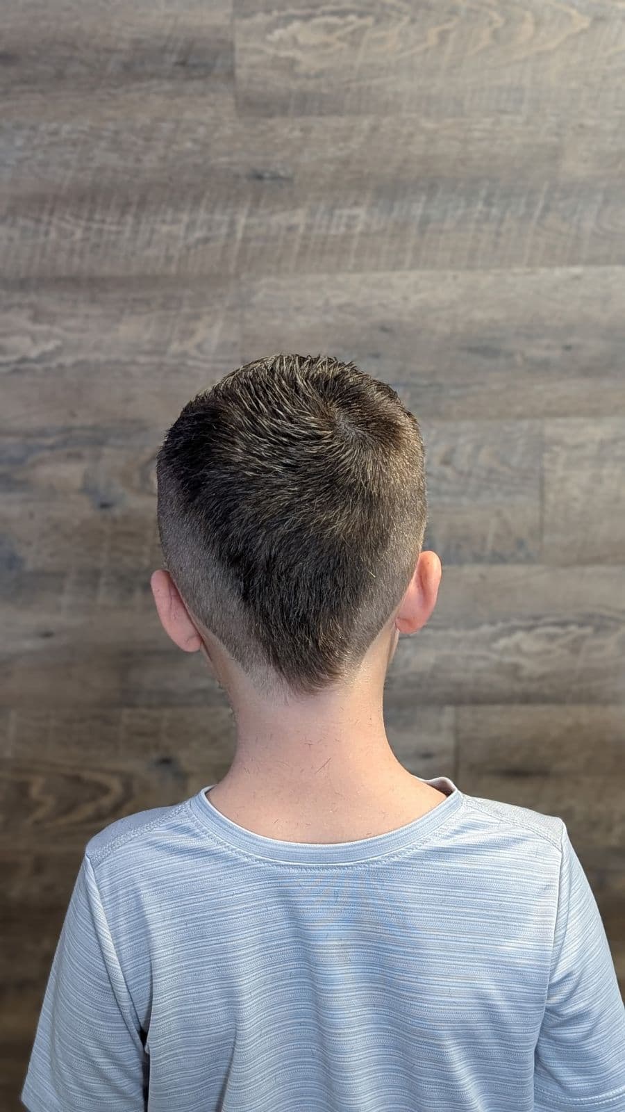 Back view of a tapered fade on a young client at Gary's Barber Shop