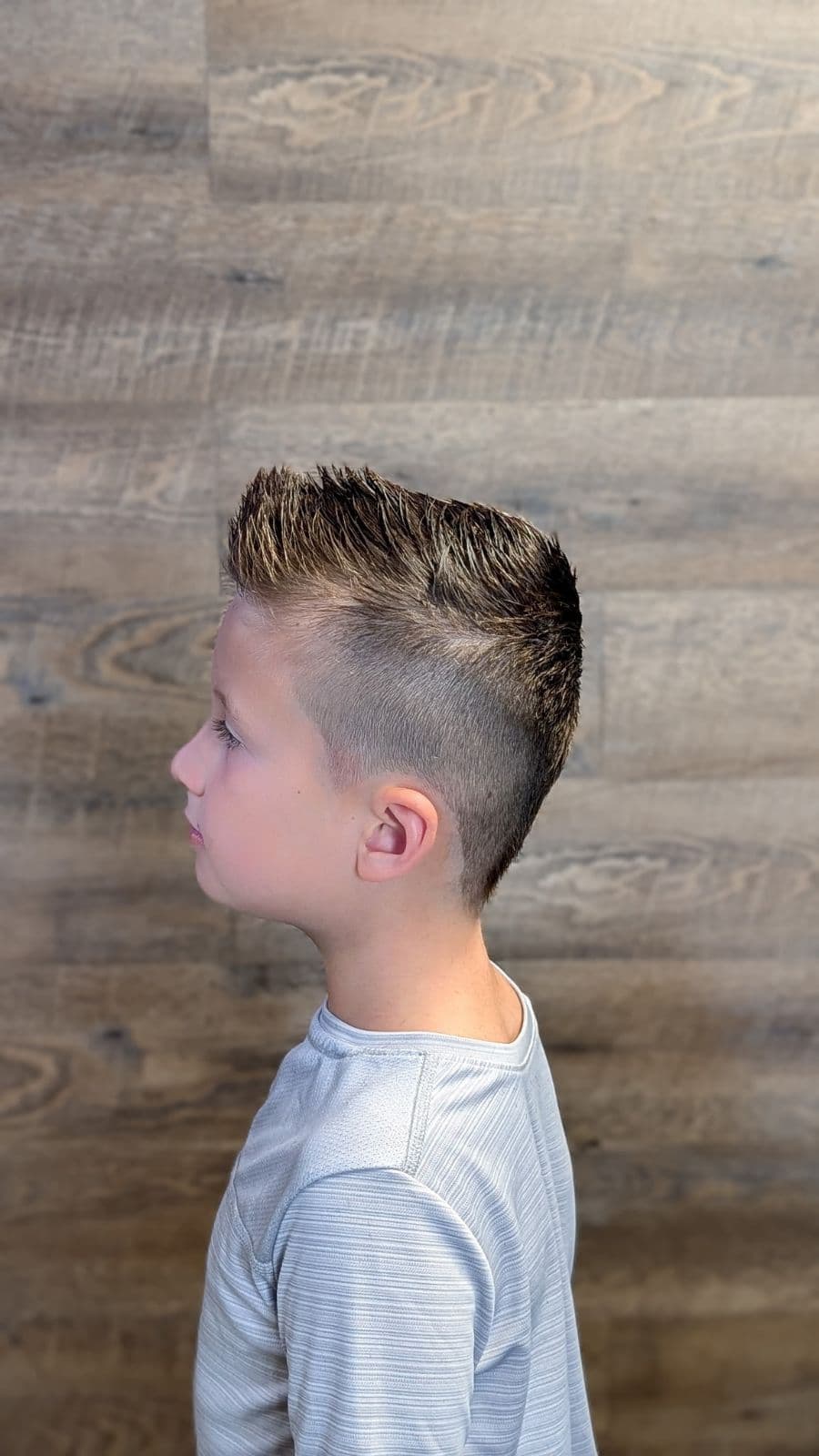 Side view of a spiky faux hawk with a skin fade at Gary's Barber Shop